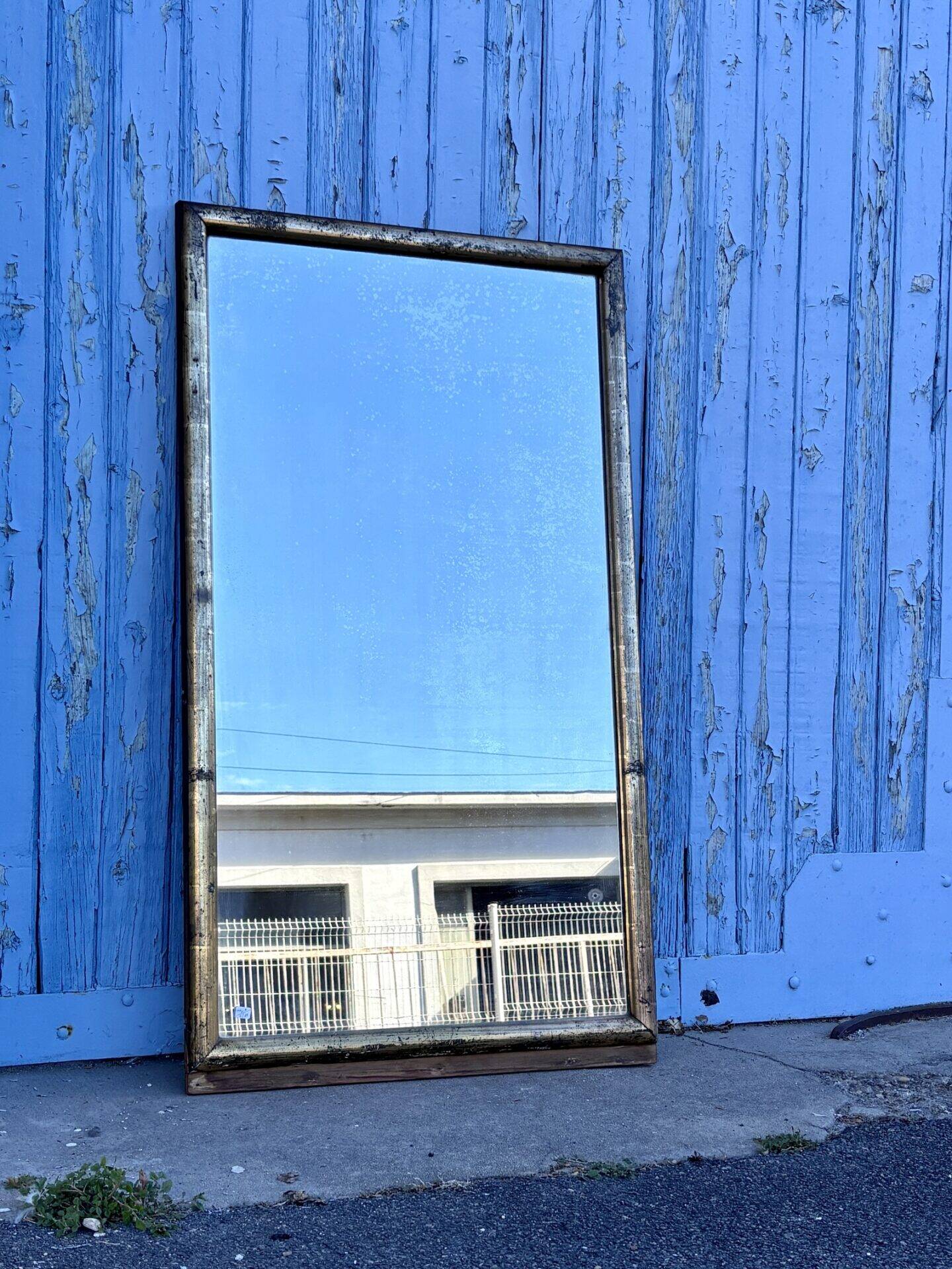 Miroir en bois doré, XXe siècle