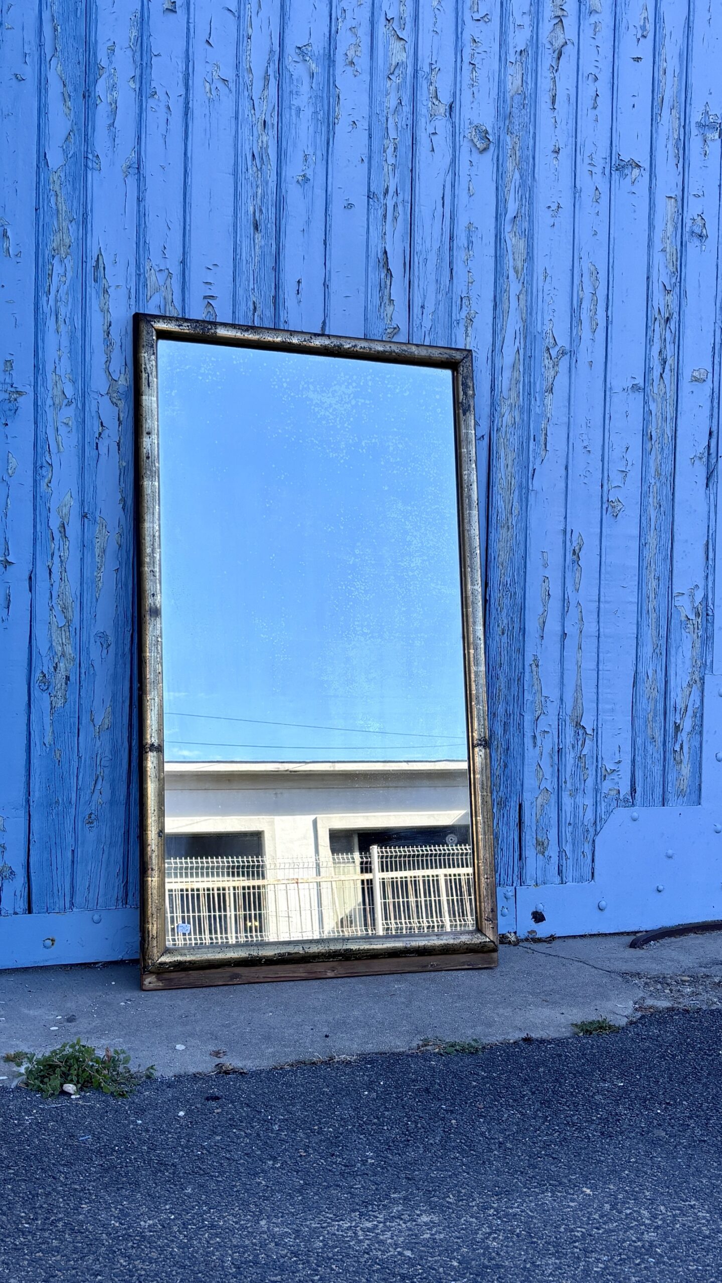 Miroir en bois doré, XXe siècle