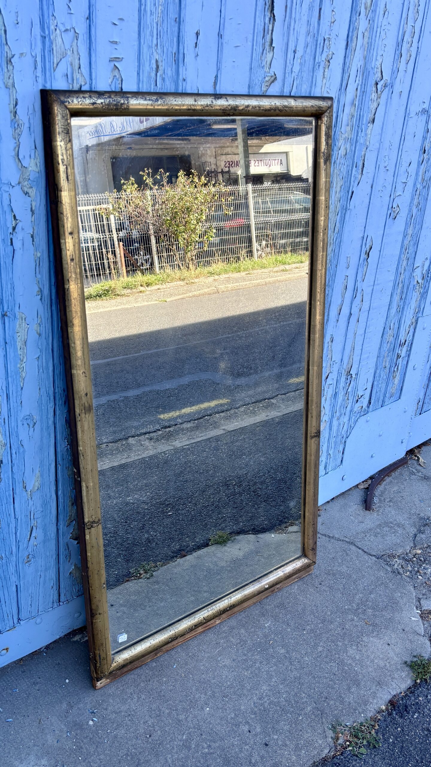 Miroir en bois doré, XXe siècle